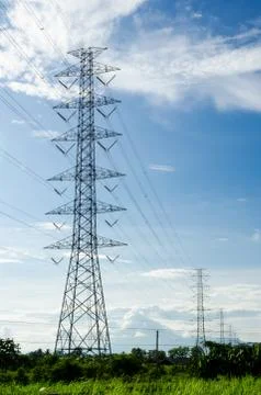 High voltage post or high voltage tower in green field Stock Photos