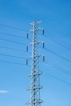 High voltage post or power transmission line tower and blue sky Stock Photos