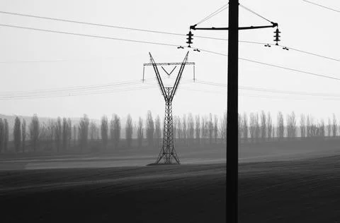 High voltage post on rice field in Thailand Stock Photos