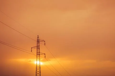 High voltage post at sunset. Foto stock