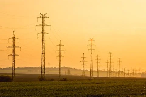 High voltage post tower sky sunset background Stock Photos
