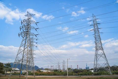 High voltage post.High-voltage tower on blue sky and clouds background Foto stock