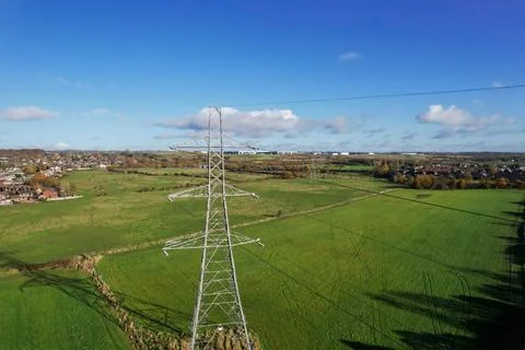 High voltage post,High voltage tower sky field grass housing esate aerial dro Stock Photos