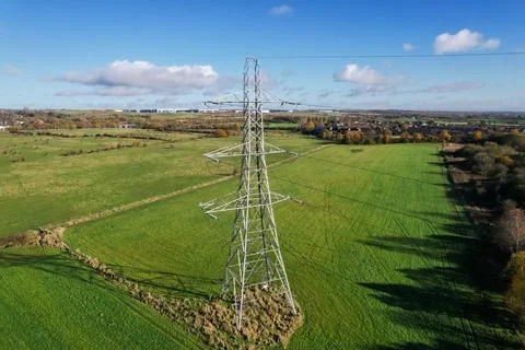 High voltage post,High voltage tower sky field grass housing esate aerial dro Stock Photos