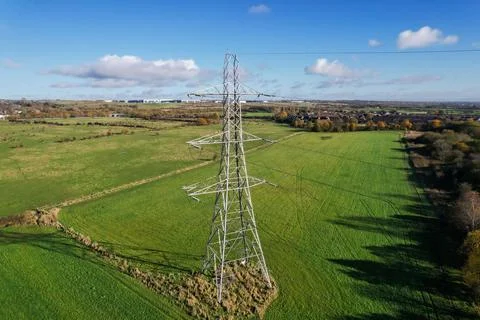 High voltage post,High voltage tower sky field grass housing esate aerial dro Stock Photos