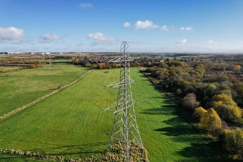High voltage post,High voltage tower sky field grass housing esate aerial dro Stock Photos