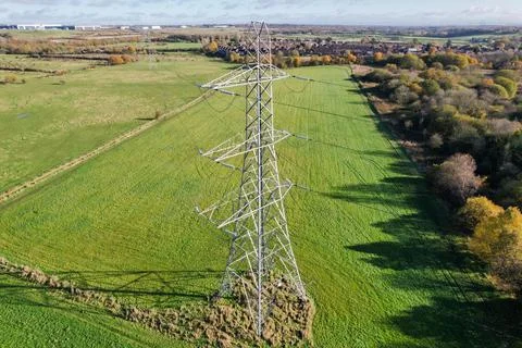 High voltage post,High voltage tower sky field grass housing esate aerial dro Stock Photos