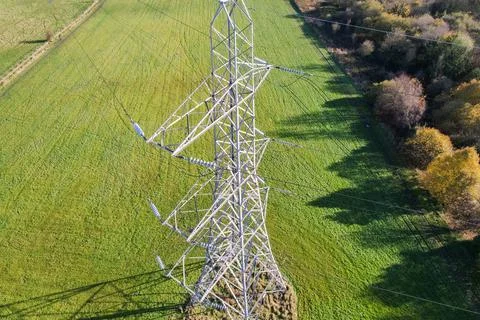 High voltage post,High voltage tower sky field grass housing esate aerial dro Stock Photos