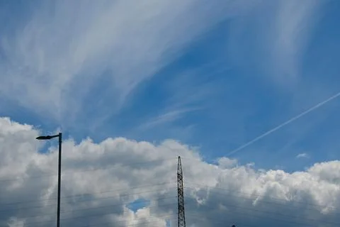 High voltage power line against blue sky energy cost concept Photos