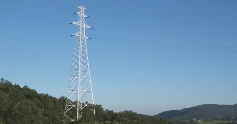 High voltage power line with blue sky background Stock Footage 148929514
