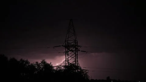 High voltage power line during heavy thunderstorm and bright lightning. Stock Footage 248327513