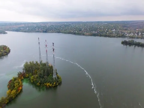 High-voltage power line. electricity supply across the river. Video stock 83176476