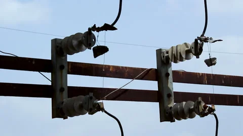 High Voltage Power Line Insulators and Disconnect Switch Infrastructure Close Up Stock Footage 337422323