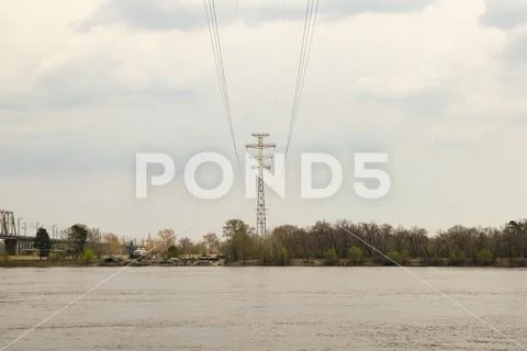 High-voltage power line over the river Stock Photos