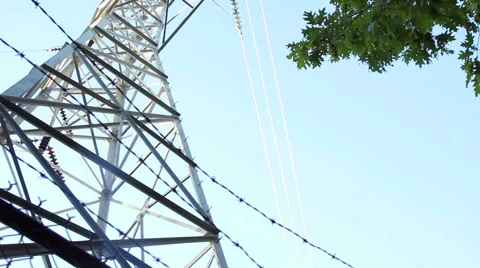 High voltage power line, pan left then pan right, low angle Stock Footage 43253092