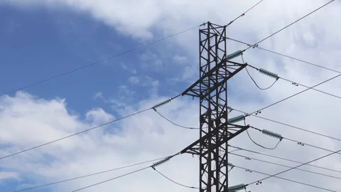 High voltage power line pylon and blue sky with clouds. Time lapse footage Stock Footage 281651355