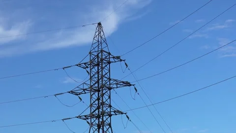 High voltage power line pylon and blue sky with clouds in the background Stock Footage 283003642