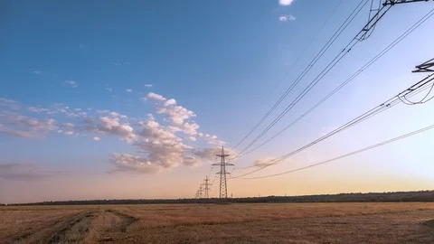 High voltage power line at sunset. Time Lapse Stock Footage 111919929
