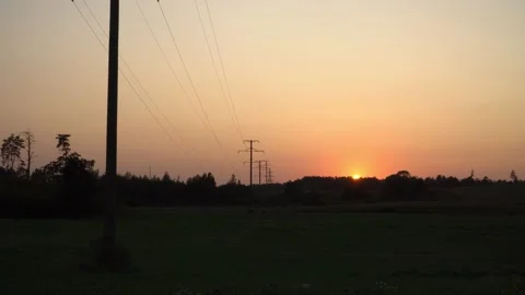 The high voltage power line on sunset time. A zoom-in effect view Video stock 155558811