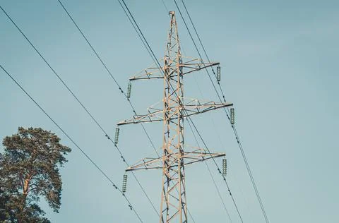 High-voltage power line support. Providing cities with electricity. Close-up Stock Photos