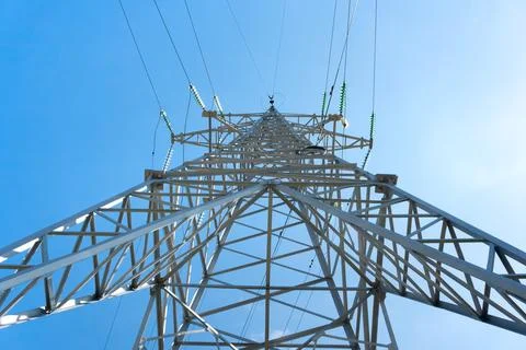 High-voltage power line support against the blue sky Stock Photos