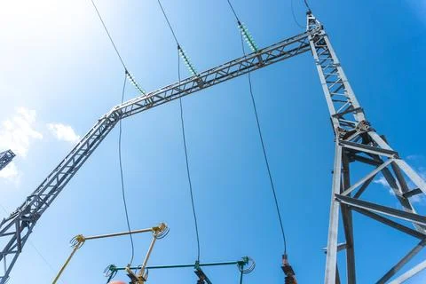 High-voltage power line support against the blue sky Stock Photos
