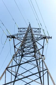 High-voltage power line support against the blue sky Stock Photos