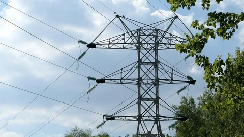 High-Voltage Power Lines Against The Blue Sky And Clouds In Spring Forest Stock Footage 89819284