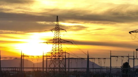 High voltage power lines and towers in rural landscape during sunset Video stock 330059545