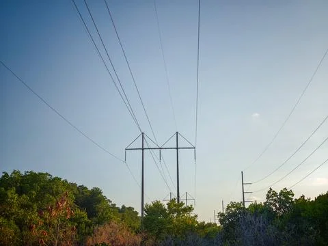 High-voltage power lines and transmission towers Stock Photos