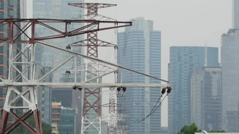 High-voltage power lines in the background of skyscrapers in Jakarta Stock Footage 200114612