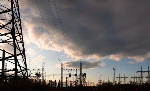 High-voltage power lines on the background of a beautiful cloudy sky Photos