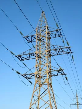 High voltage power lines on blue background 스톡 사진