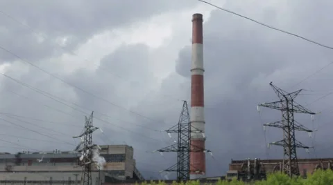 High-voltage power lines, from the chimney power plant emits smoke Stock Footage 64972515