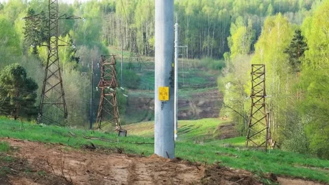High Voltage Power Lines. Concept of electricity and energy generation, aerial Stock-Footage 307311527