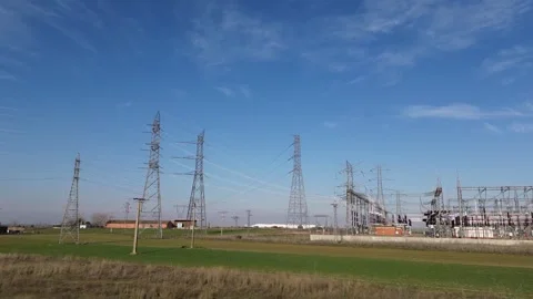 High Voltage Power Lines Converging at Electrical Substation Stock Footage 330731226