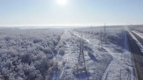 High-voltage power lines crossing the highway. Stock Footage 224922737