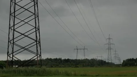 High voltage power lines in the field Stock Photos