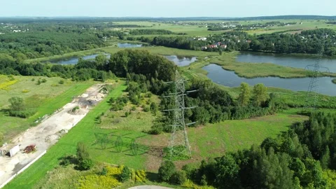 High voltage power lines over scenic lake Stock Footage 292243903