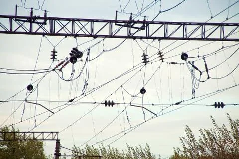 High-voltage power lines over train station Stock-Fotos