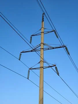 High-voltage power lines, sky above Фото