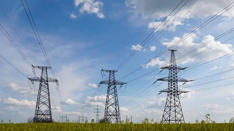High-voltage power lines at sunset. electricity distribution station. high volta Видео 107648949