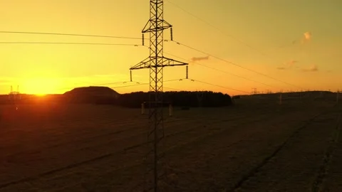 High voltage power lines at sunset Stock Footage 173267636