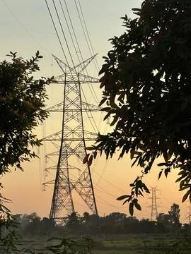 High Voltage Power Lines at Sunset in a Rural Landscape Stock Photos