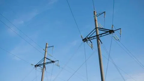 High voltage power lines. wire power source on poles Stock Photos