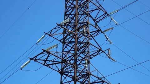 High-voltage power lines with wires against the blue sky. Panorama Stock Footage 249472930