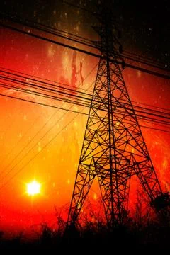 High voltage power pole middle of a cornfield with orange sky and galaxy Stock Photos