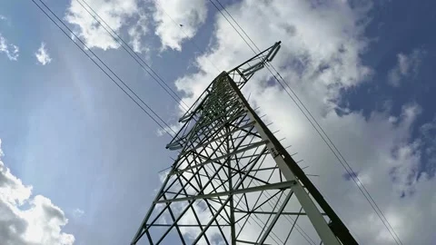 High Voltage Power Pylon with Blue Sky and Clouds on Background Stock Footage 141383663