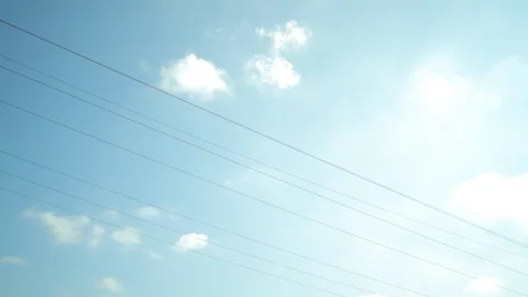 High voltage power pylons close up on against the sun. Silhouette, pan shot Stock Footage 86214339