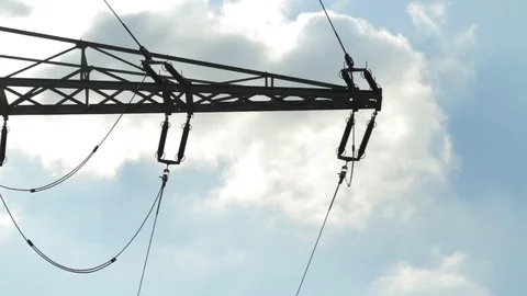 High voltage power pylons close up on against blue sky. Silhouette Stock Footage 86218487